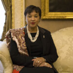 Colour photo of Patricia Scotland sitting on a couch