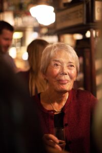 Colour photograph of Tess Gill at El Vino's